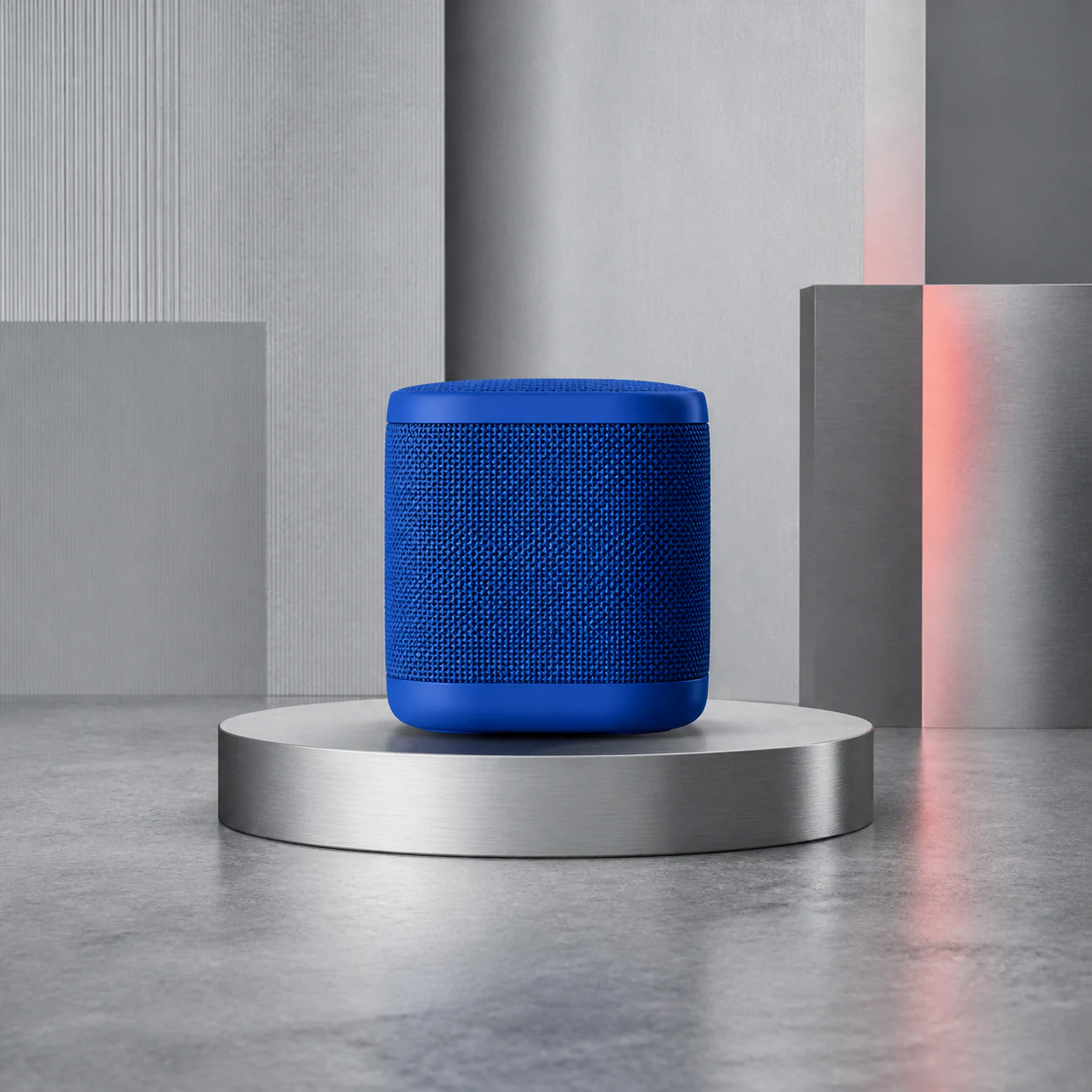 Square product composition featuring a cobalt wireless speaker