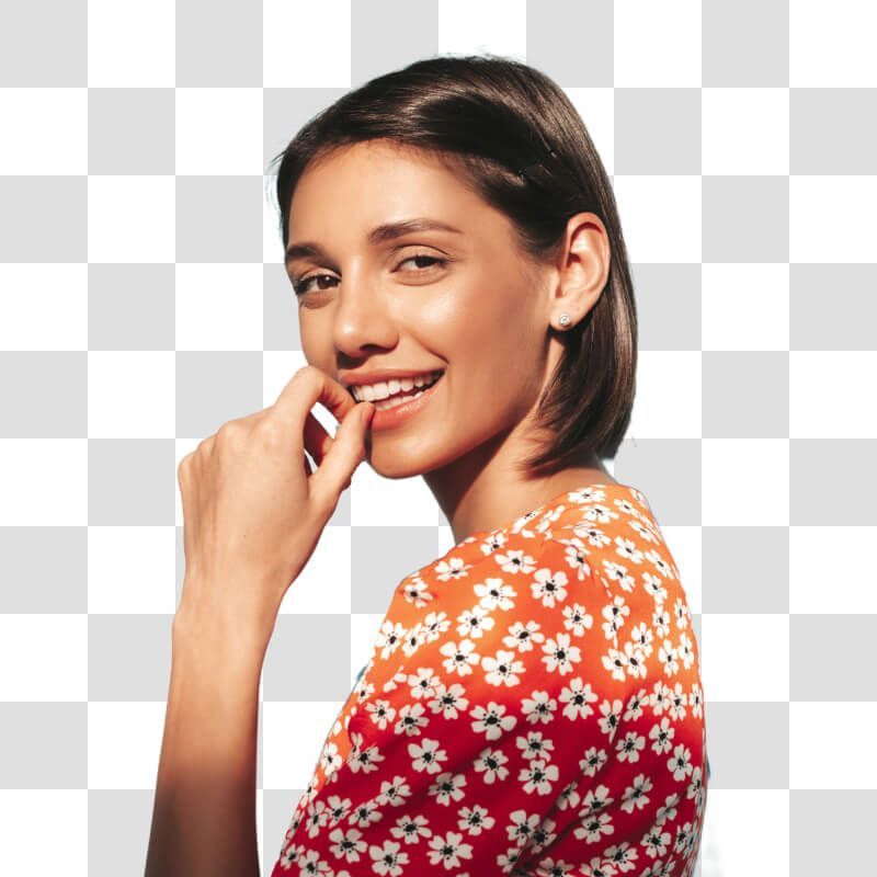A smiling woman in an orange top isolated for use as a profile picture